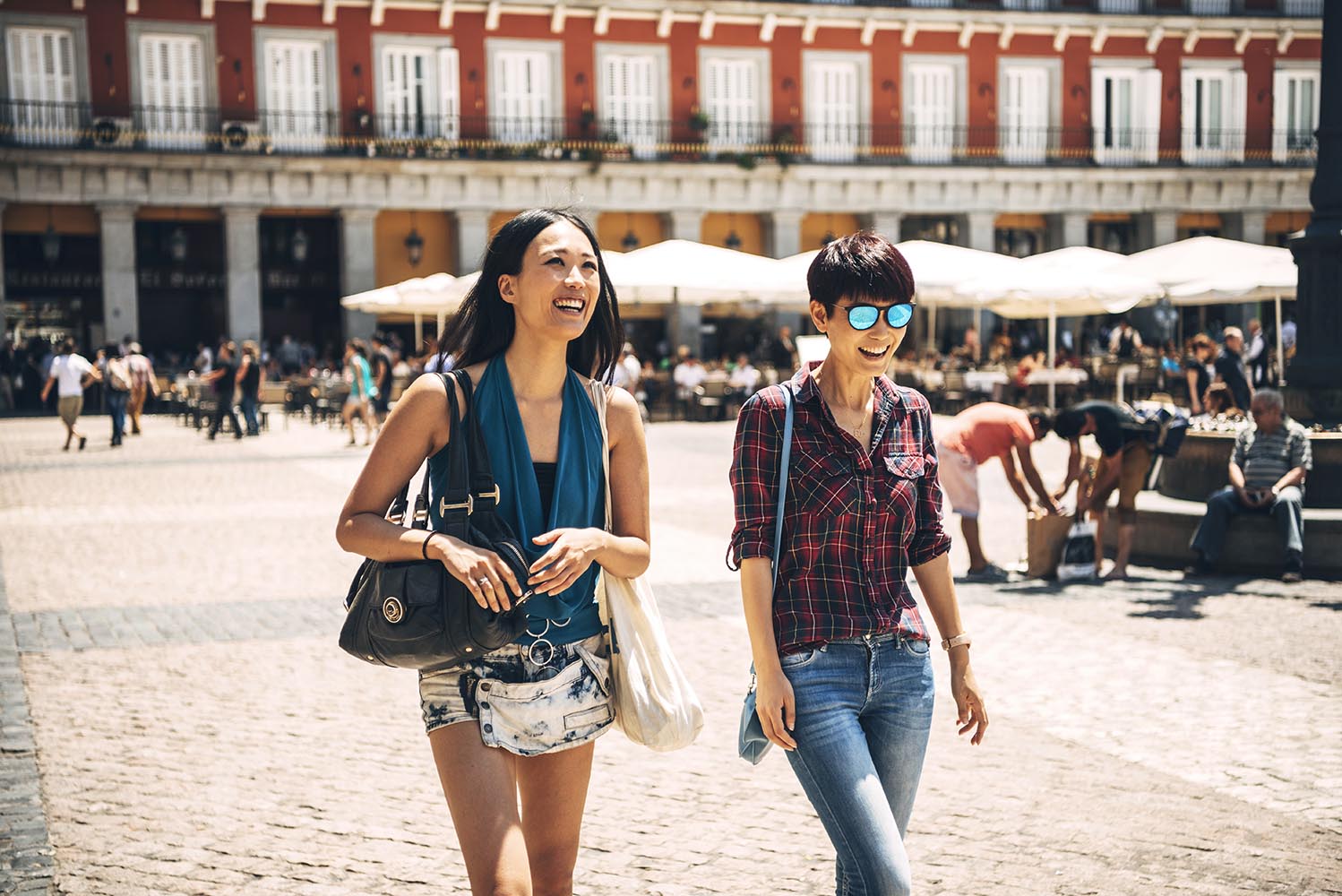 Female tourists walking on square