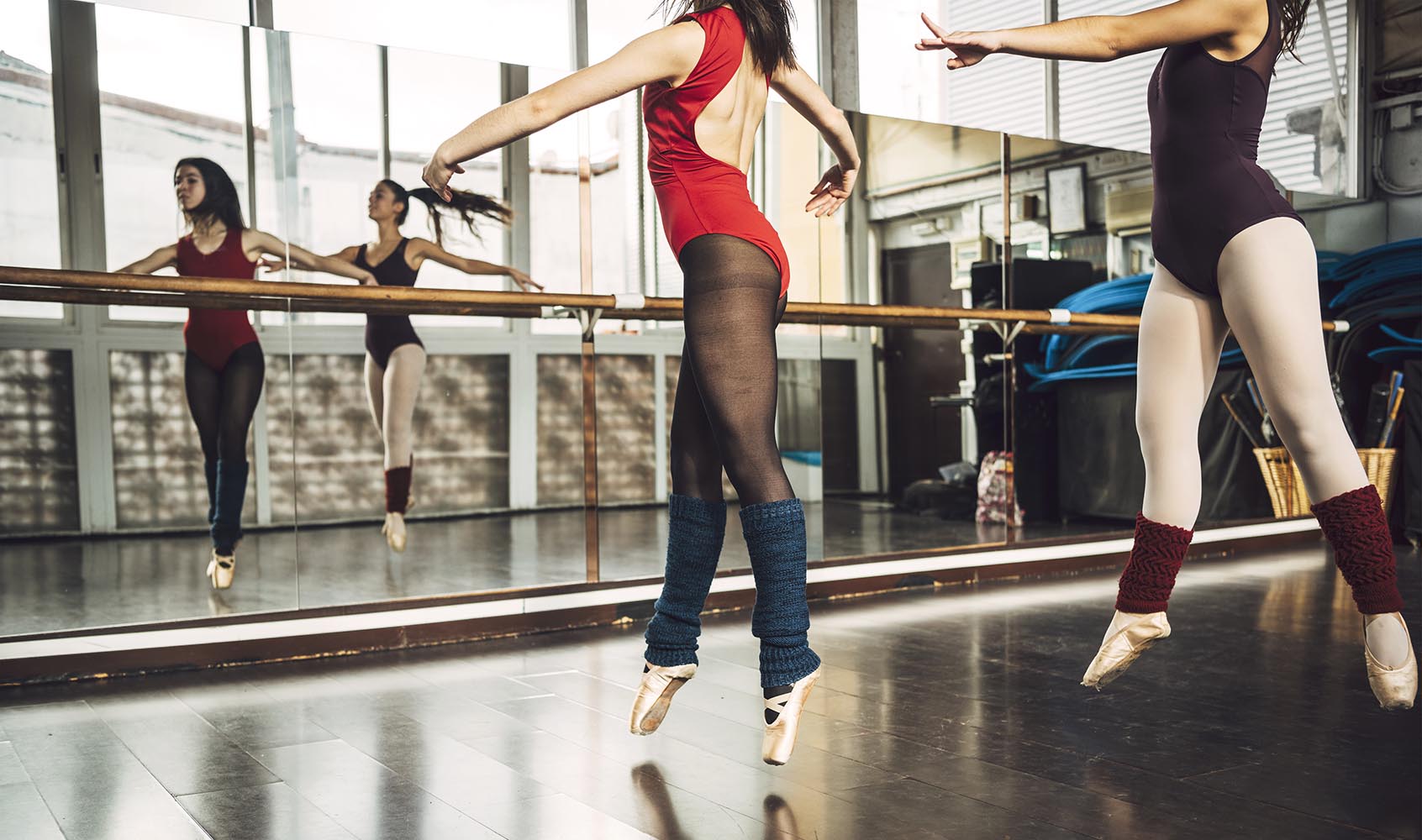 Ballerinas training pirouettes in studio