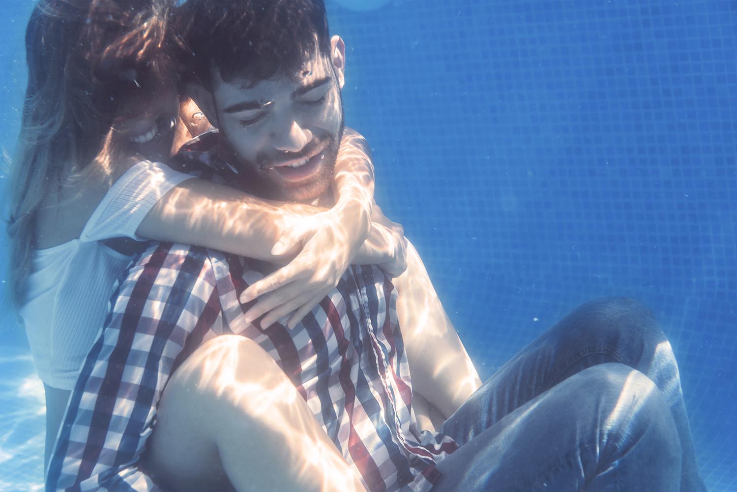 Couple embracing underwater