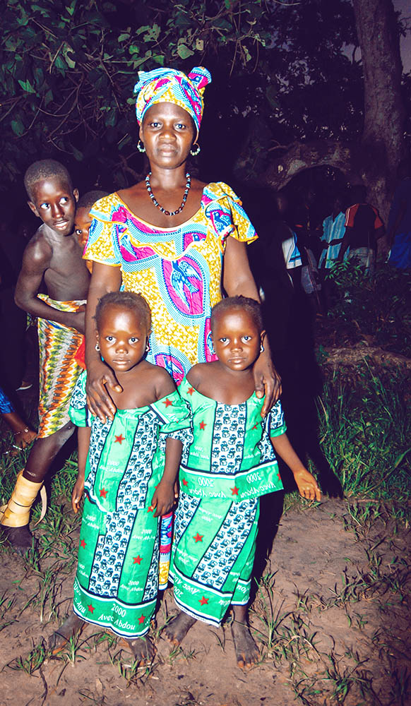 SENEGAL - SEPTEMBER 19: Mother and her twin daughters posing for