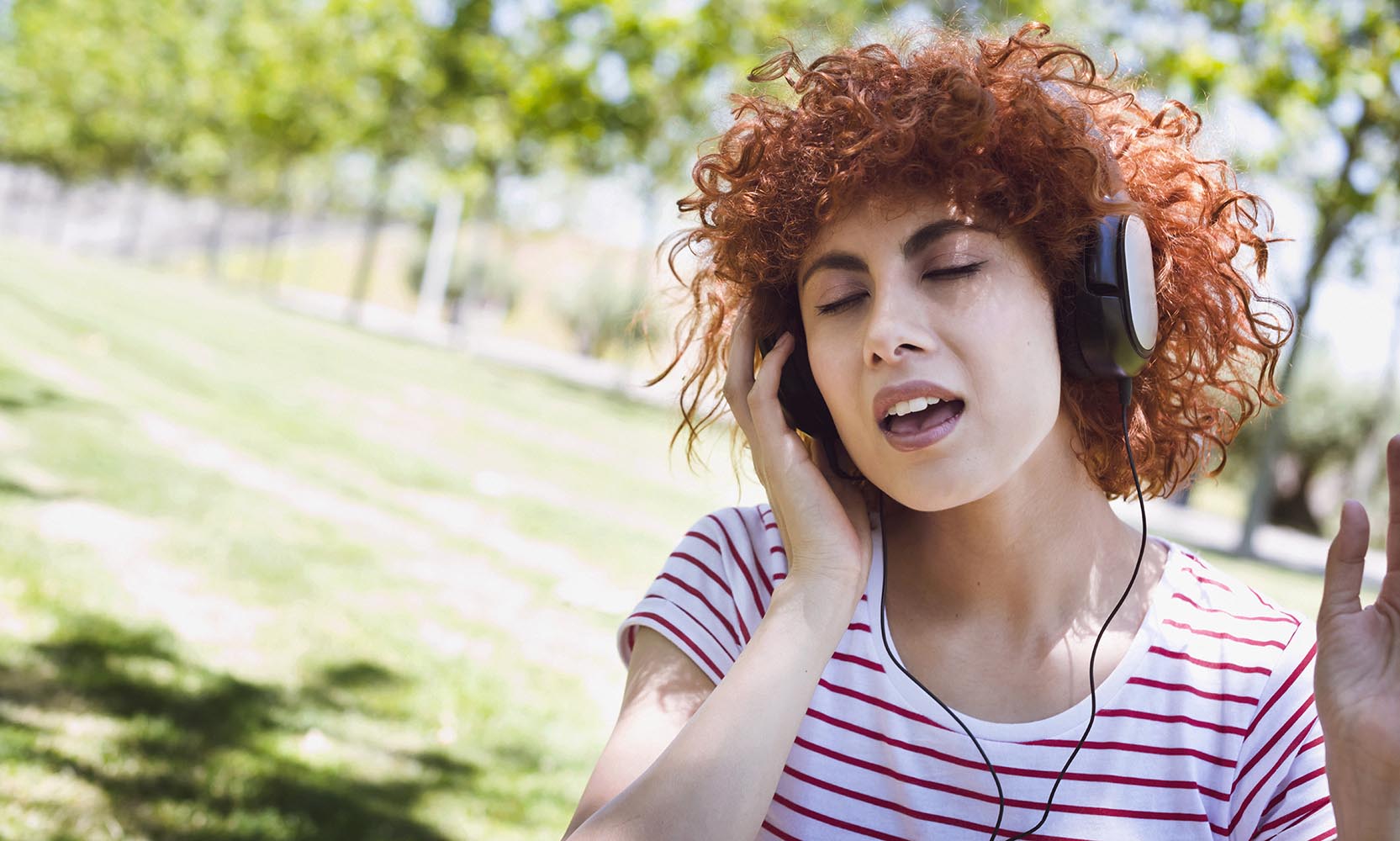 Young beautiful brunette woman girl listening music headphones o