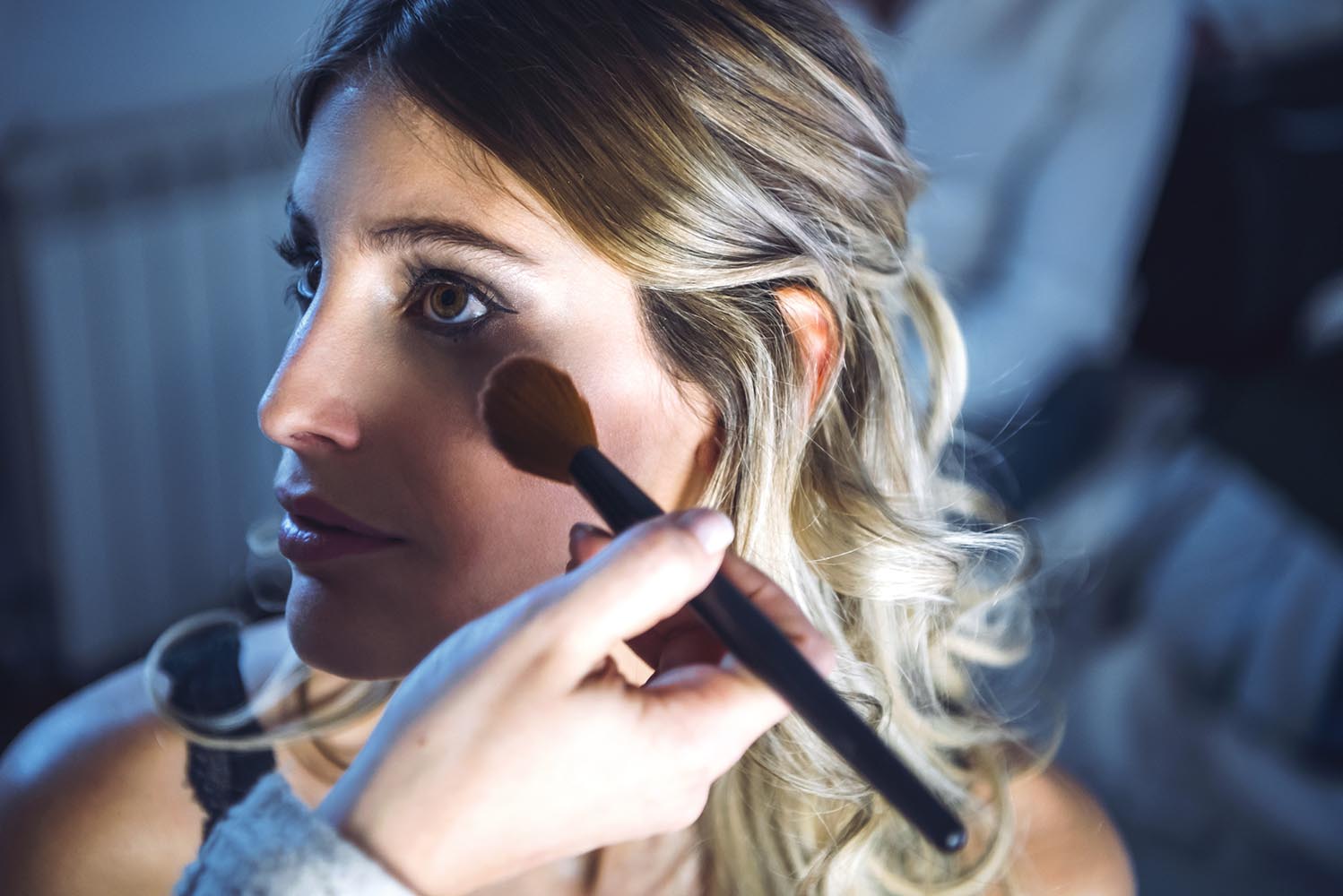 Female model putting on makeup