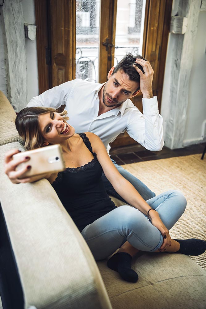 Lovely couple playing while taking selfie