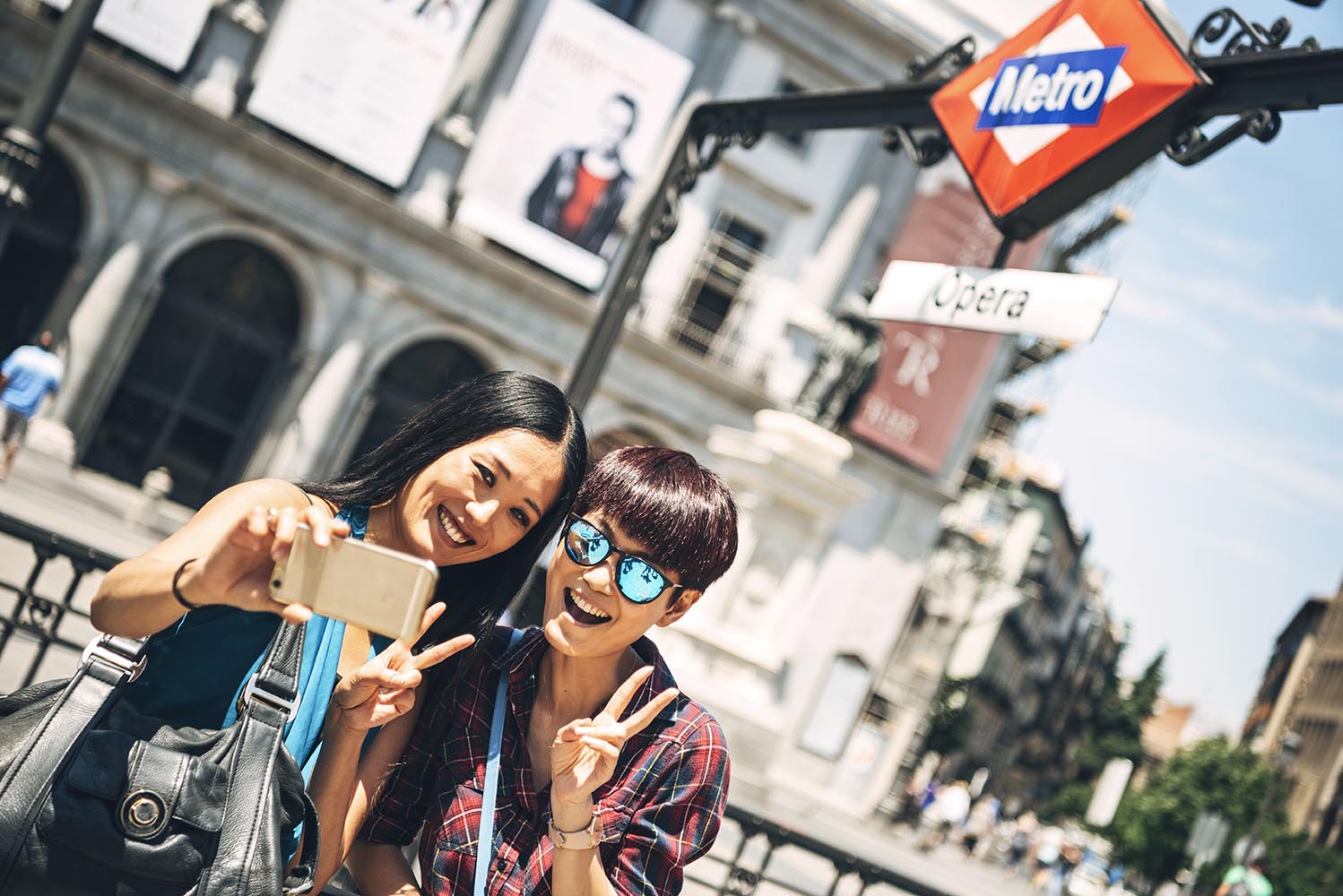 Lovely tourists taking selfie on street