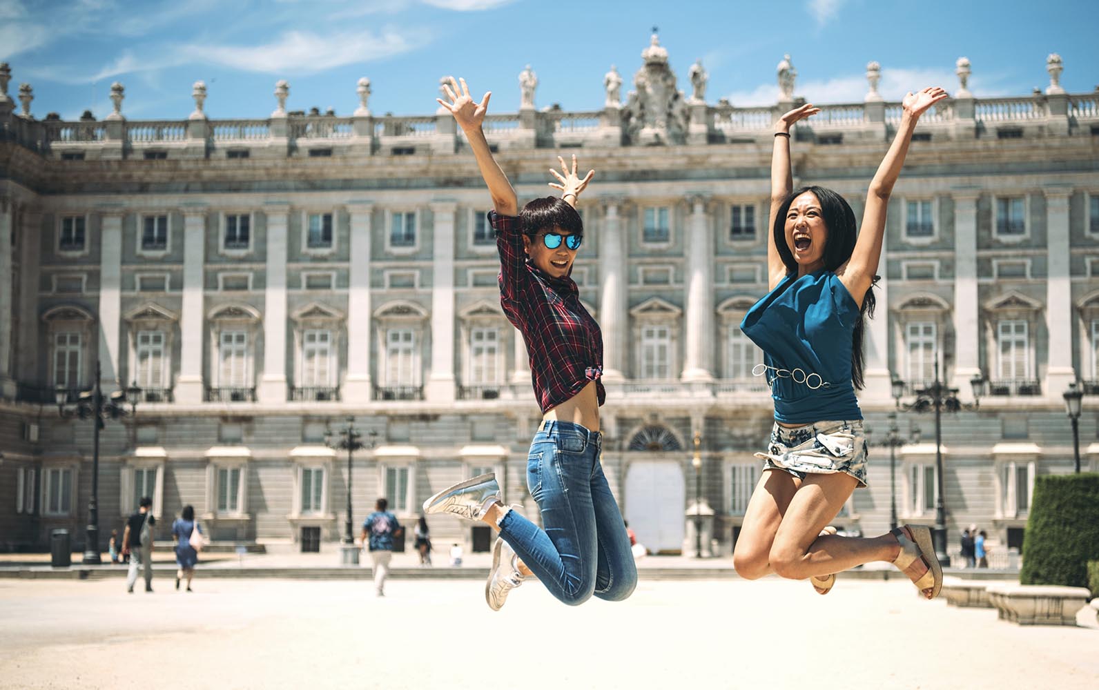 Cheerful female tourists in jump