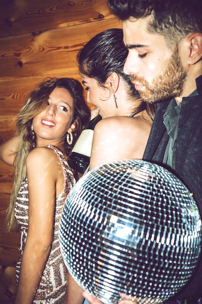 Glamour friends on party with disco ball