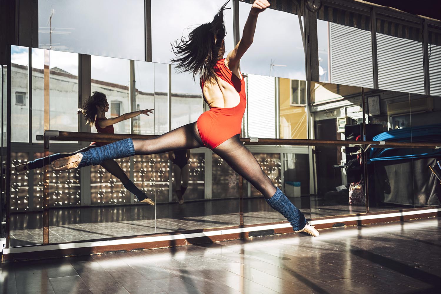 Ballerina jumping in splits