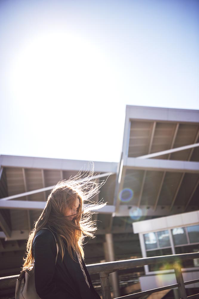 Woman with hair waving in sunlight