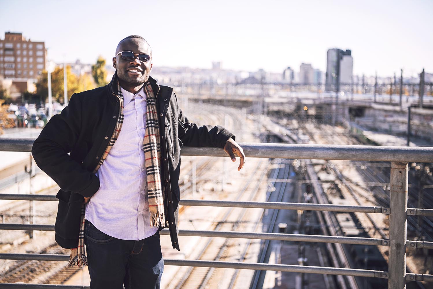 Stylish confident black man on urban background