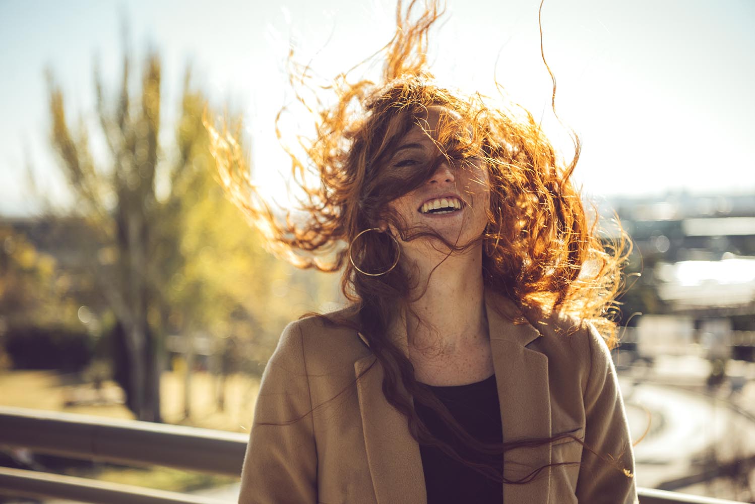 Happy woman with flying hair