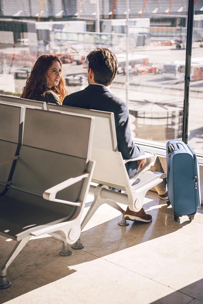 Man and woman sitting in airport