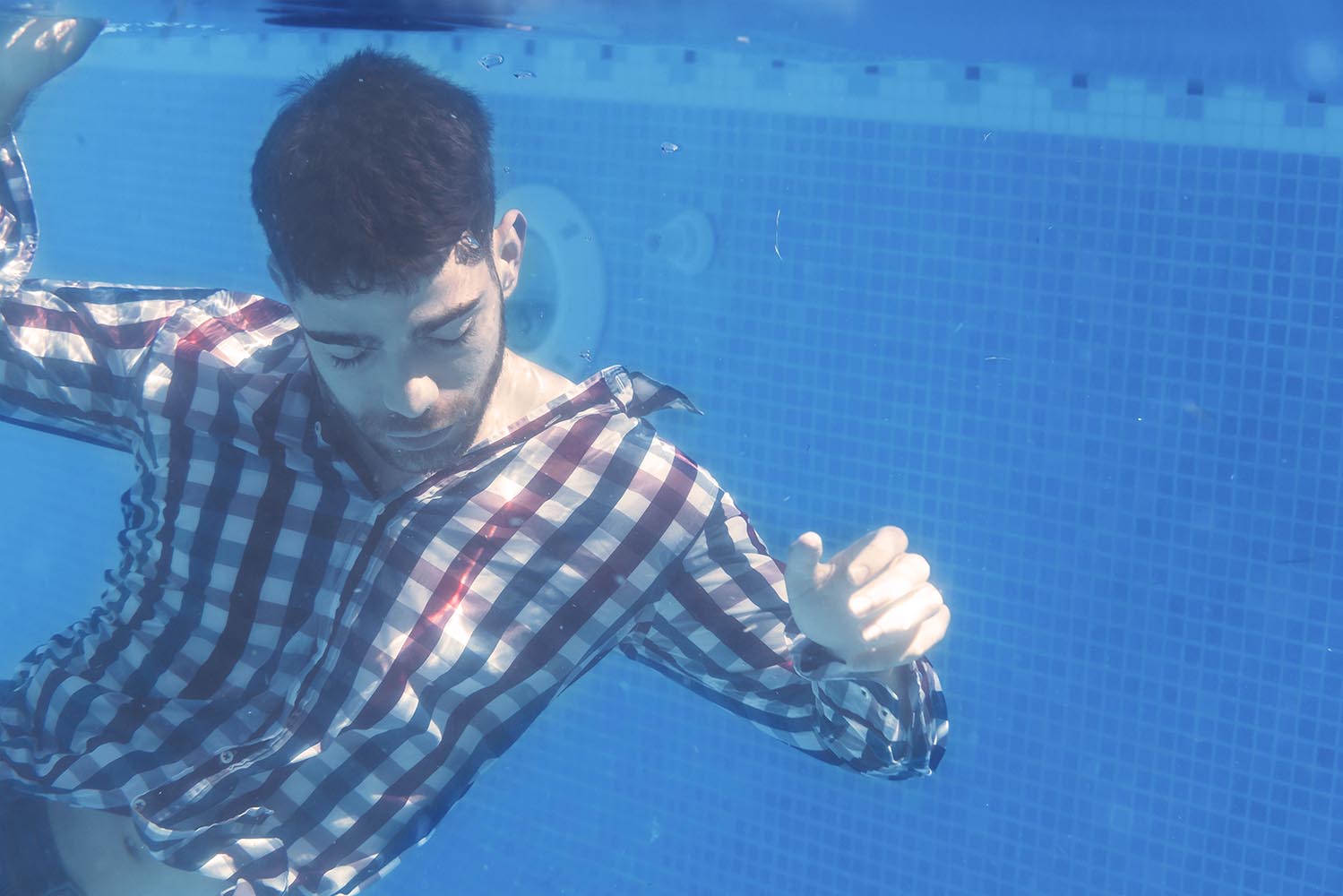 Man floating underwater