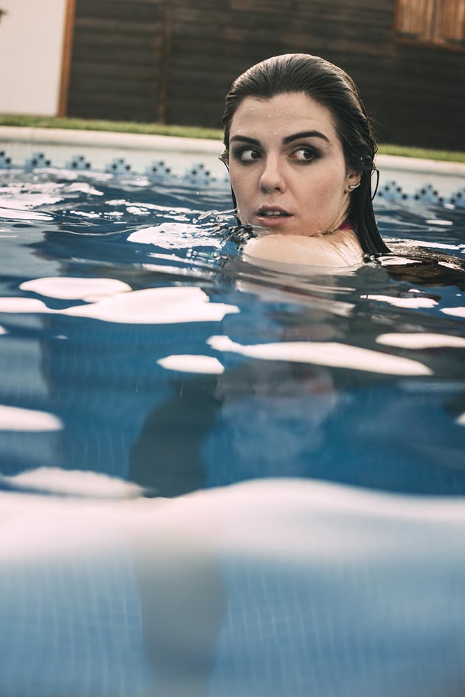 Woman looking back in pool