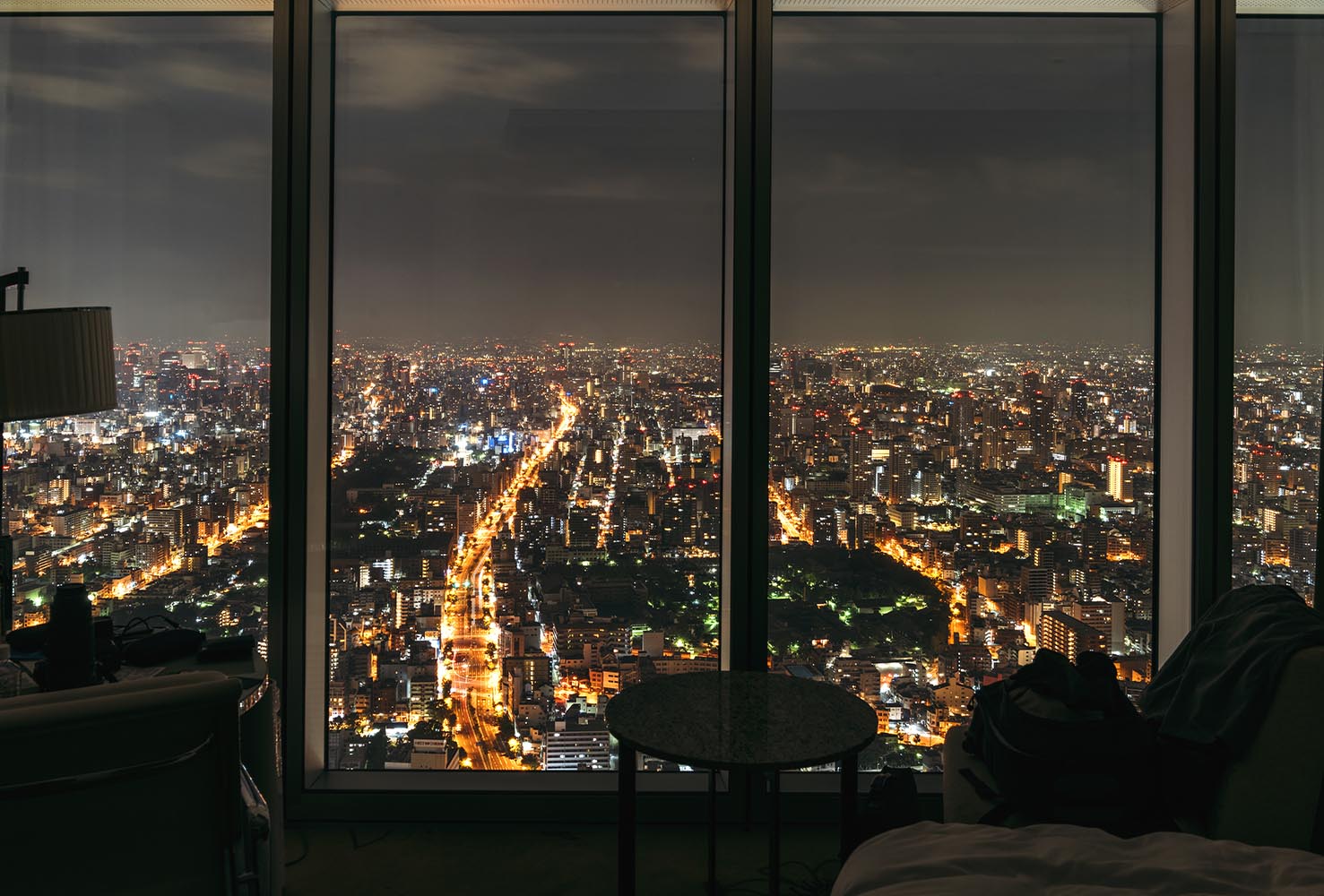 Night shot of Osaka city inside hotel room, Japan